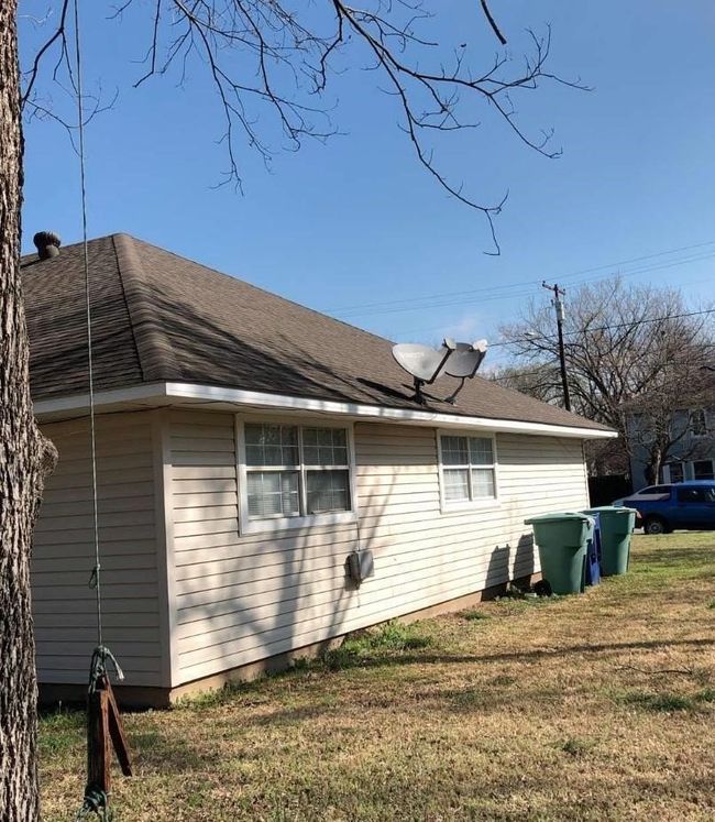 View of side of home with a lawn | Image 13