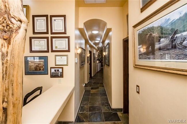 Corridor with stone tile floors and baseboards | Image 71