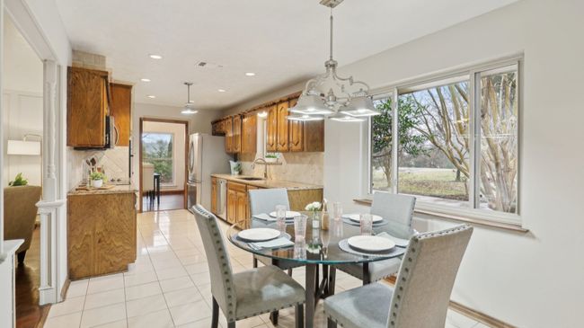 Dining area with visible vents, plenty of natural light, light tile patterned flooring, and recessed lighting | Image 14