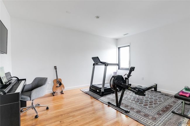 Generous Bedroom 3 with enough space for a music room, home gym and home office. | Image 37