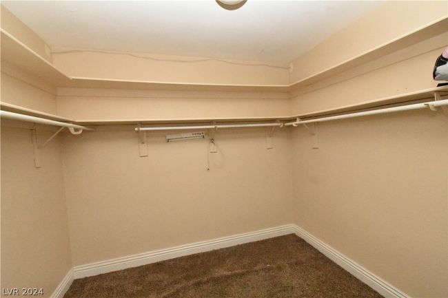 large walk in closet in main bedroom | Image 28