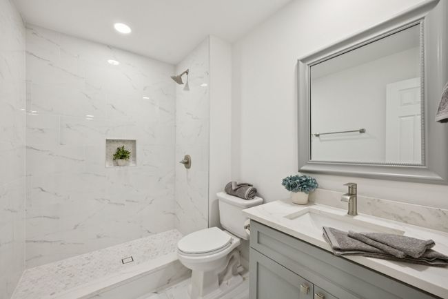 This lovely updated hall bath has all the designer touches! | Image 33