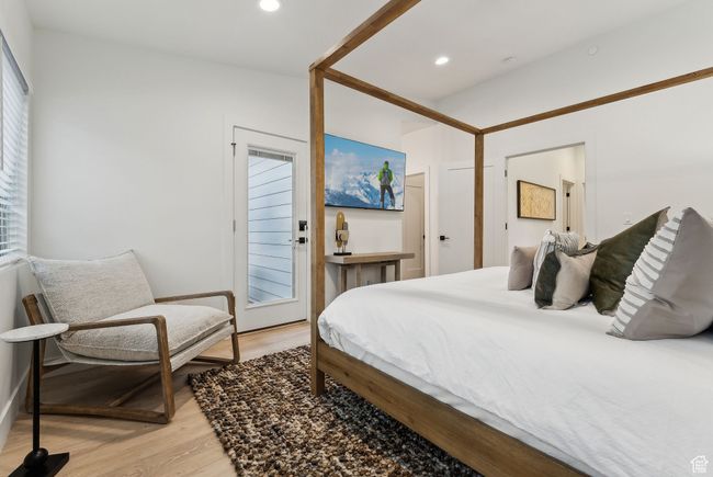 Bedroom featuring light hardwood / wood-style floors | Image 23