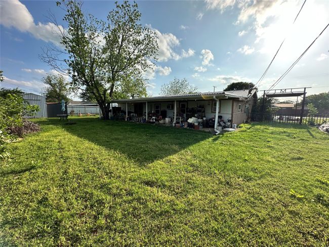 View of yard, covered patio and covered RV/boat parking | Image 23