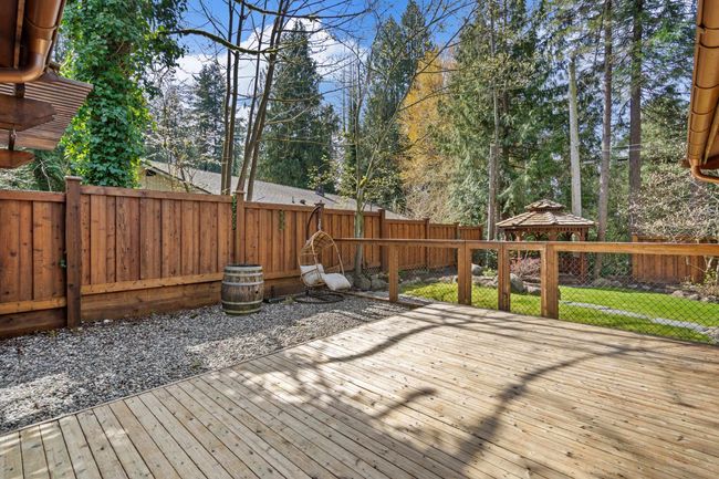Deck featuring a gazebo and a fenced backyard | Image 31
