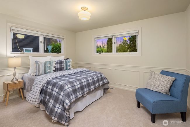Charming bedroom (one of 3 upstairs) is roomy yet cozy and features windows on two sides with custom Hunter Douglas blinds. | Image 22