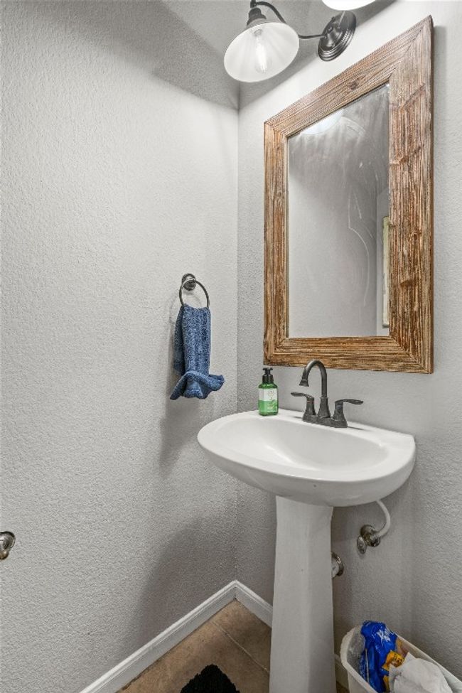 Bathroom featuring tile patterned flooring and baseboards | Image 14