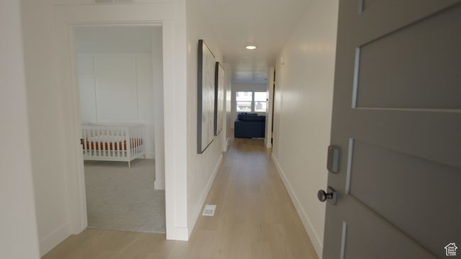 Step inside to a bright, welcoming entryway with wide halls flooded with natural light. It’s simple, airy, and gives off a clean modern vibe that instantly feels like home. | Image 5