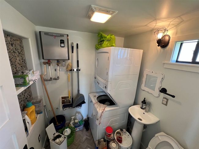Half bath/utility room with washer/drywer, on demand how water heater | Image 10