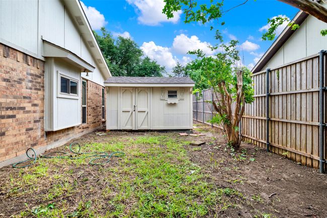 View of side yard featuring a storage unit | Image 35