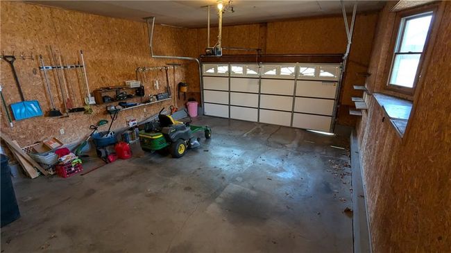 Garage with a garage door opener | Image 29
