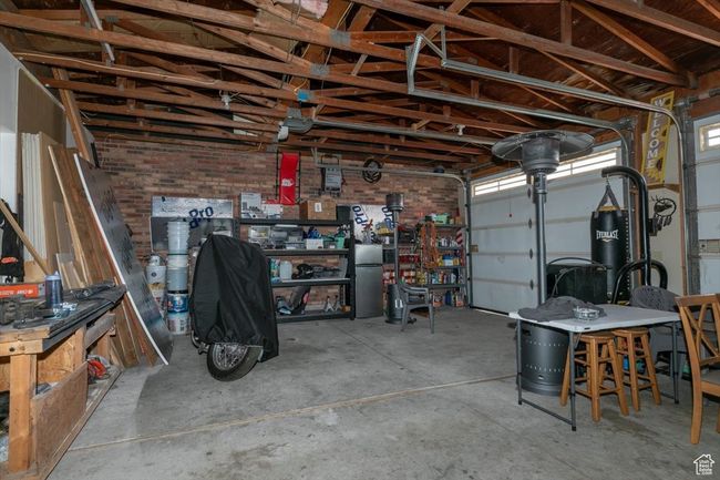 Garage with a workshop area | Image 38