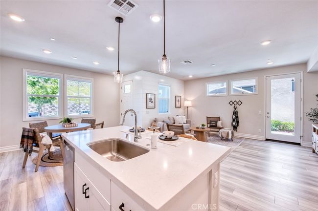 Open concept gourmet kitchen, dining area and family room. | Image 7