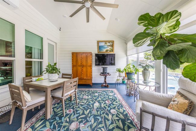 Envision a modern sun room completed in 2023, designed to be an ideal extra space for relaxation and enjoyment.This advanced cooling system ensures that the room remains at an optimal temperature, providing comfort regardless of the weather outside. | Image 28
