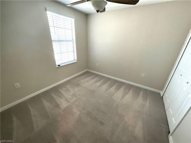 Unfurnished room with a ceiling fan and carpet floors | Image 17