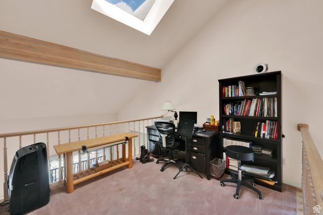 Office with carpet, high vaulted ceiling, a skylight, and beamed ceiling | Image 13