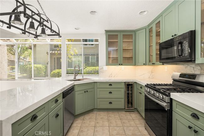 Kitchen has stainless steel appliances. | Image 15