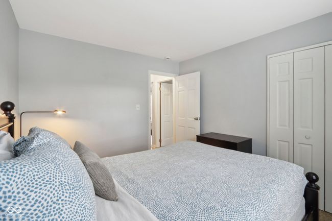 bedroom featuring a closet | Image 17