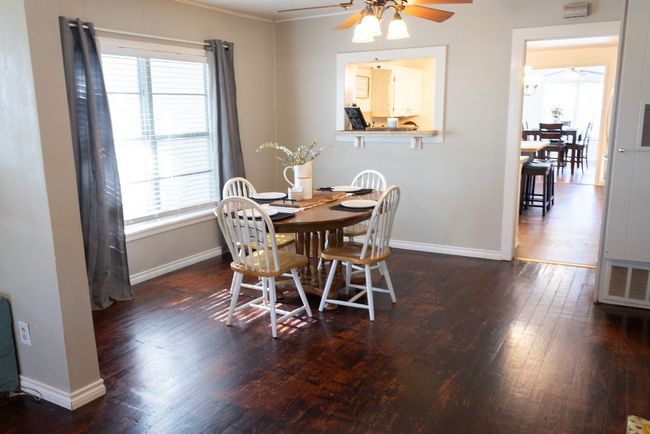 Dining area with ceiling fan, wood-type flooring, and ornamental molding | Image 6