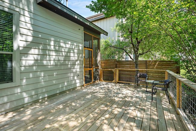 With ample room for outdoor furniture, the deck is perfect for casual gatherings, evening meals, or just soaking in the tranquility of the natural surroundings | Image 6