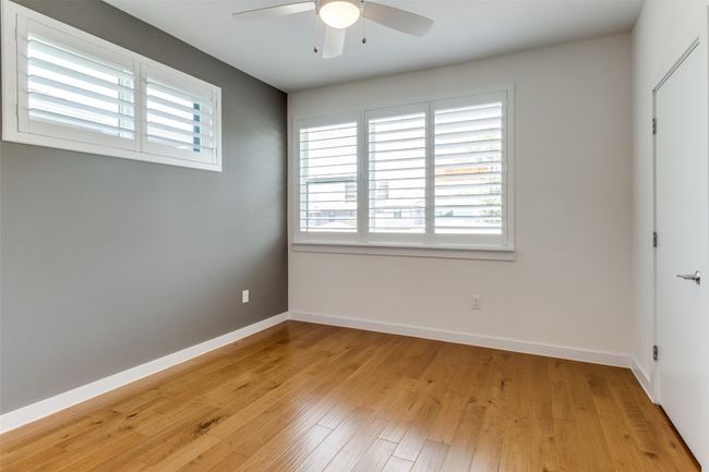 Secondary Bedrooms With Engineered Hardwood Floors | Image 8