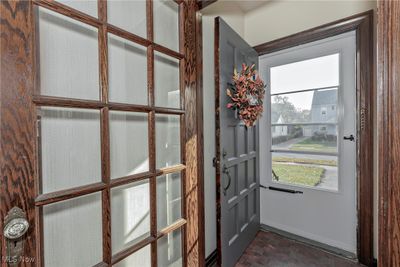 Please come in the foyer with glass paneled door and coat closet. | Image 3