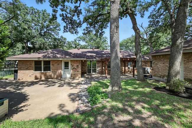 Ranch-style house with brick siding and a patio area | Image 28