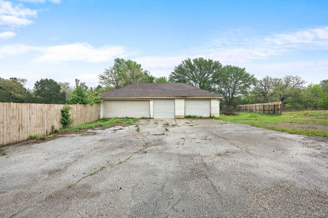 Detached 4 car garage with lean to in the back. | Image 7