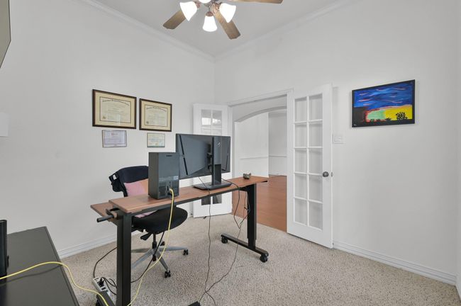 The glass pane French doors bring in additional light and give the office an open and airy feeling. | Image 6
