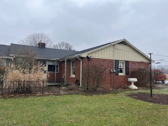 View of side of home with a lawn | Image 4