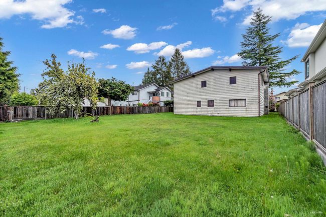 View of fenced backyard | Image 21