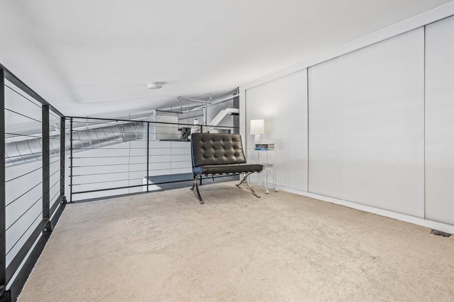 Upper level loft area - additional storage located behind sliding doors | Image 23