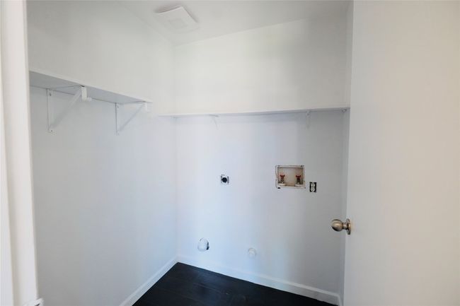 Laundry room featuring hookup for a washing machine, hookup for an electric dryer, and dark wood-type flooring | Image 17