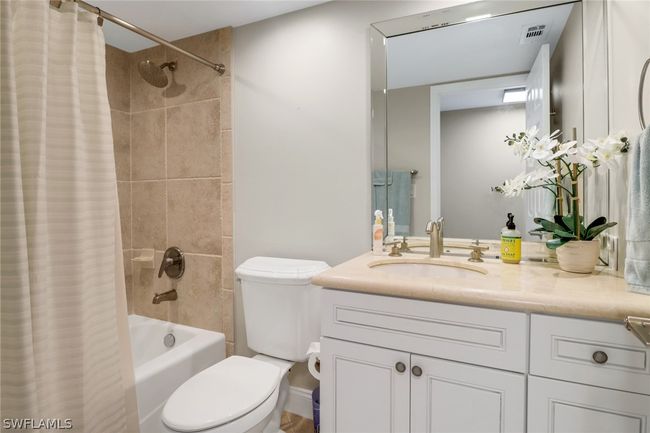 Full bathroom featuring vanity, toilet, and shower / bath combination with curtain | Image 22