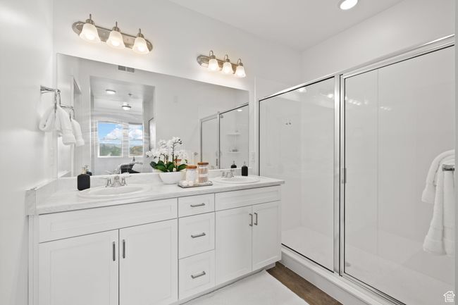 Ensuite bathroom with a stall shower, double vanity, and recessed lighting | Image 29