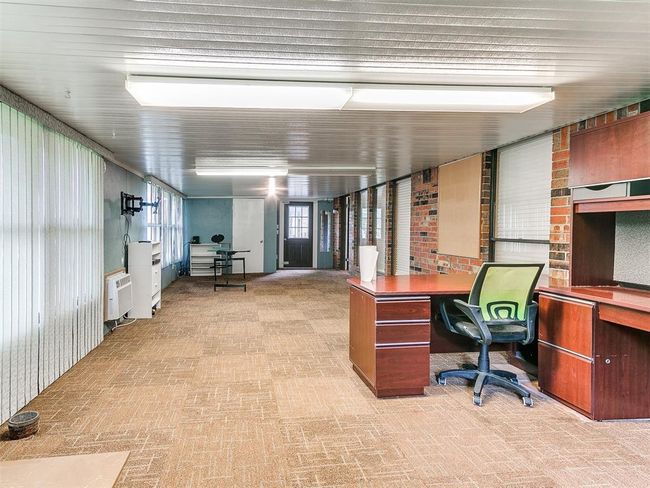 Home office with brick patterned flooring | Image 33