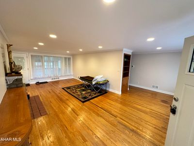 Main living room with hard wood floors. | Image 3