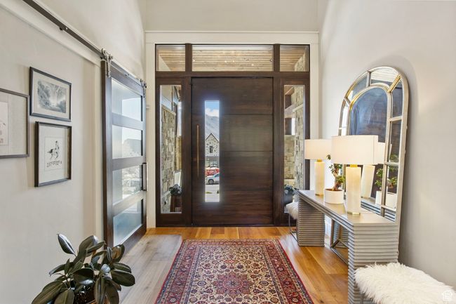 Entrance foyer featuring wood finished floors and a barn door | Image 13
