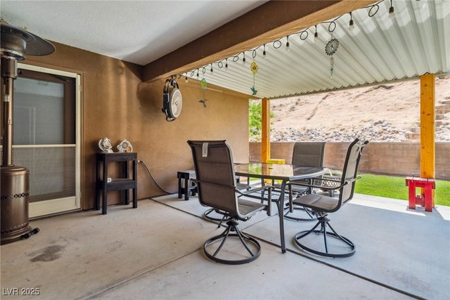 Fenced backyard with outdoor dining area and a patio area | Image 35