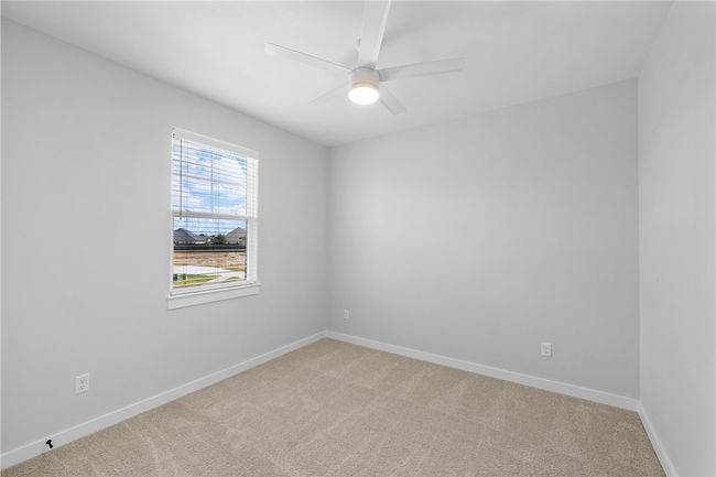 Carpeted empty room with ceiling fan | Image 25