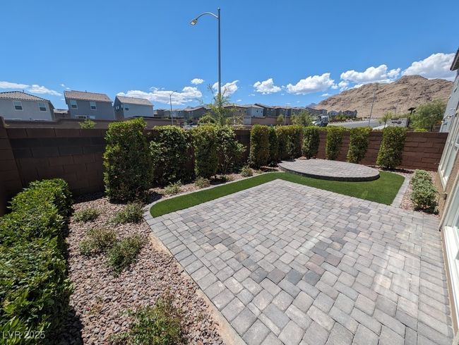 Fenced backyard featuring a patio and a residential view | Image 14