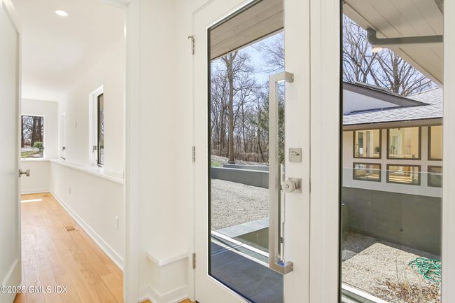 Koi Pond awaits outside. Side front private entrance conveniently located near a bedrm ensuite can be used for au pair, office, guests. | Image 32