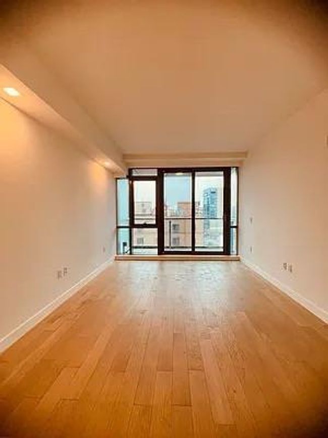 Unfurnished room with light wood finished floors and baseboards | Image 13