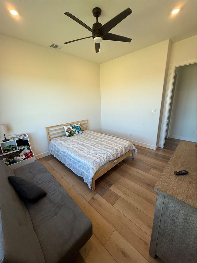 Bedroom featuring recessed lighting, light wood-style flooring, and ceiling fan | Image 6