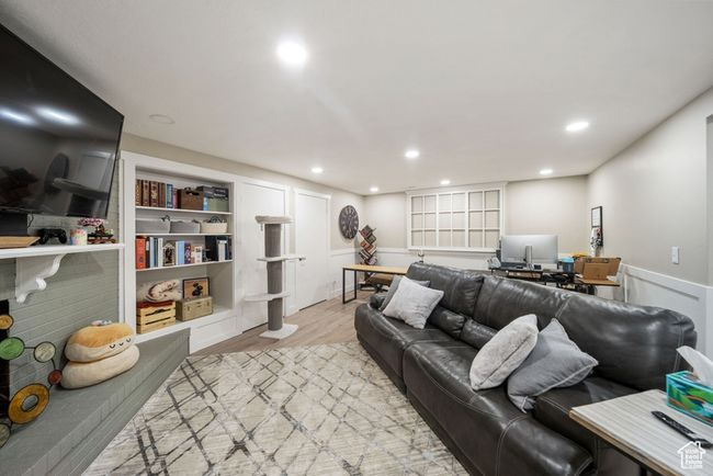 Living room featuring an office area, light wood finished floors, and recessed lighting | Image 22