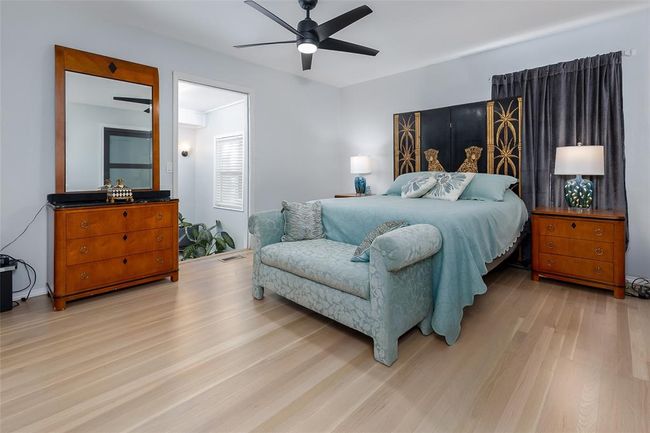 Bedroom featuring ceiling fan and light wood-type flooring | Image 26
