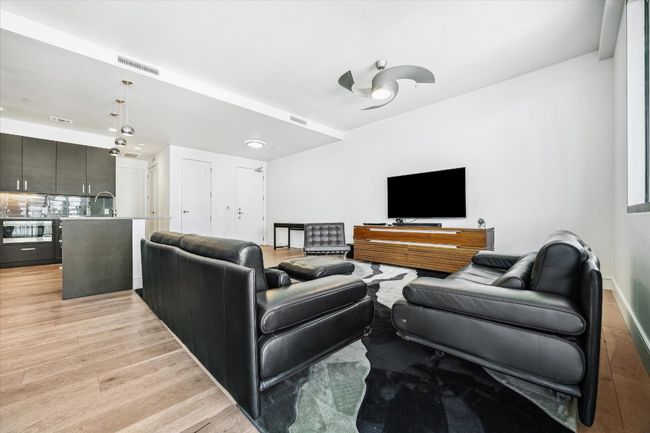 Living room featuring visible vents and light wood-type flooring | Image 6