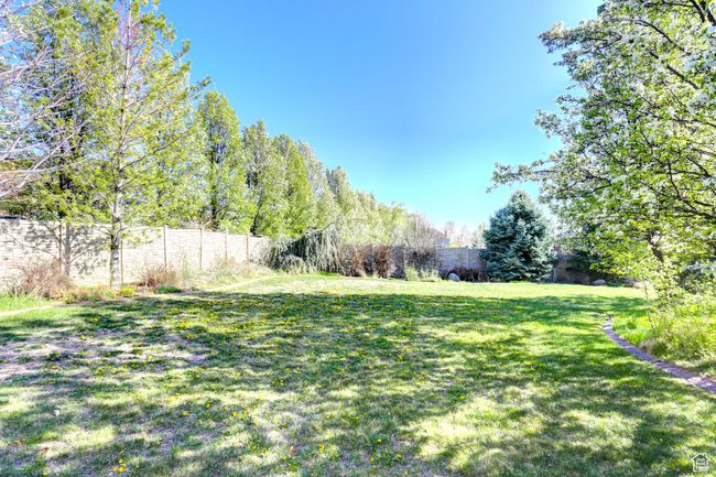 View of yard featuring a fenced backyard | Image 59