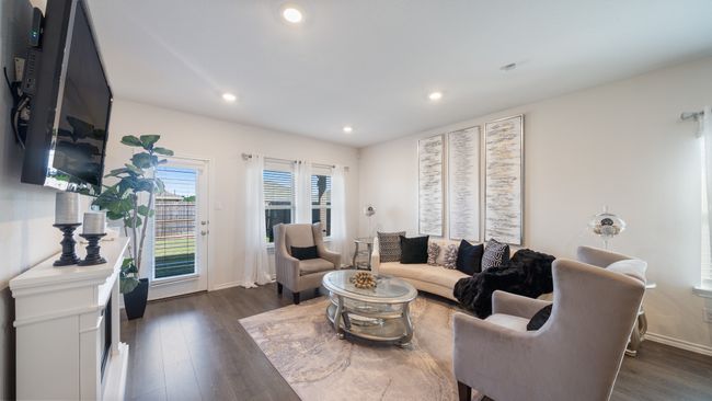 Living area with dark wood-style flooring and recessed lighting | Image 12