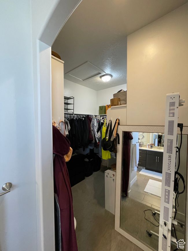 Walk in closet featuring arched walkways | Image 35